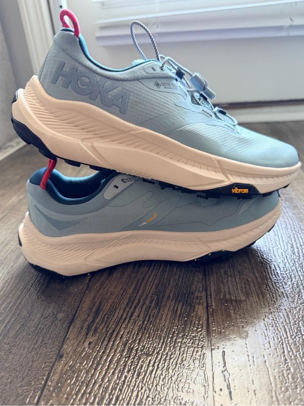 Hoka Light Blue Trail Sneakers with Pink Pull Tabs